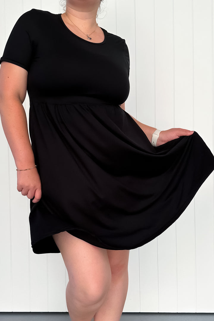 Black - Knee Length Dress - Short Sleeve - Pockets